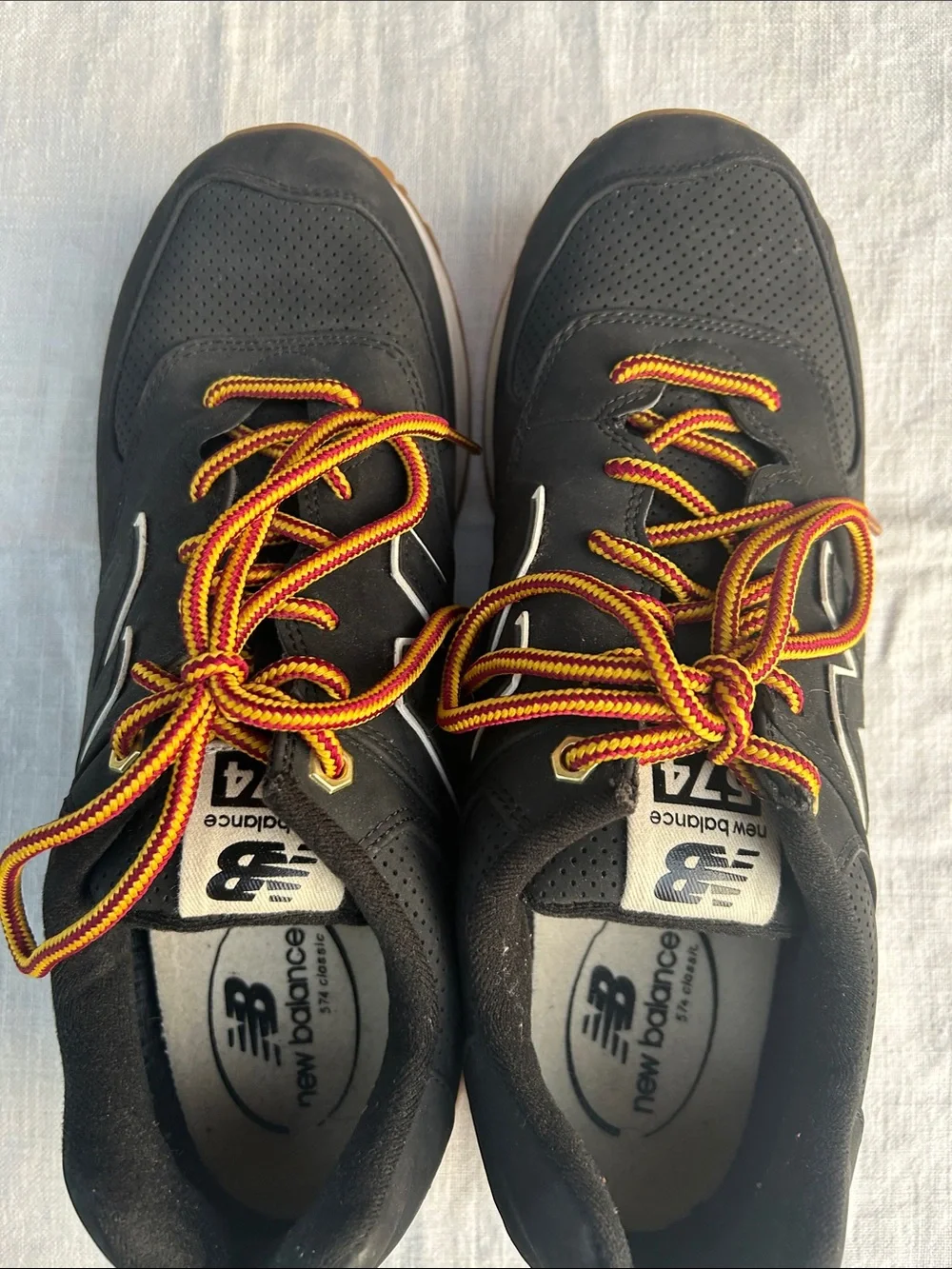 New Balance Men’s Black Sneakers with Tan Sole and Yellow-Orange Laces